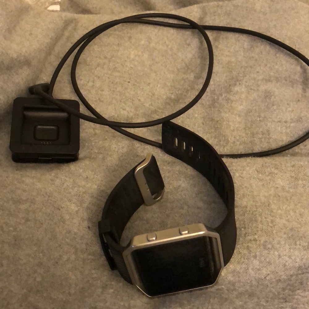Black Fitbit Blaze with charger